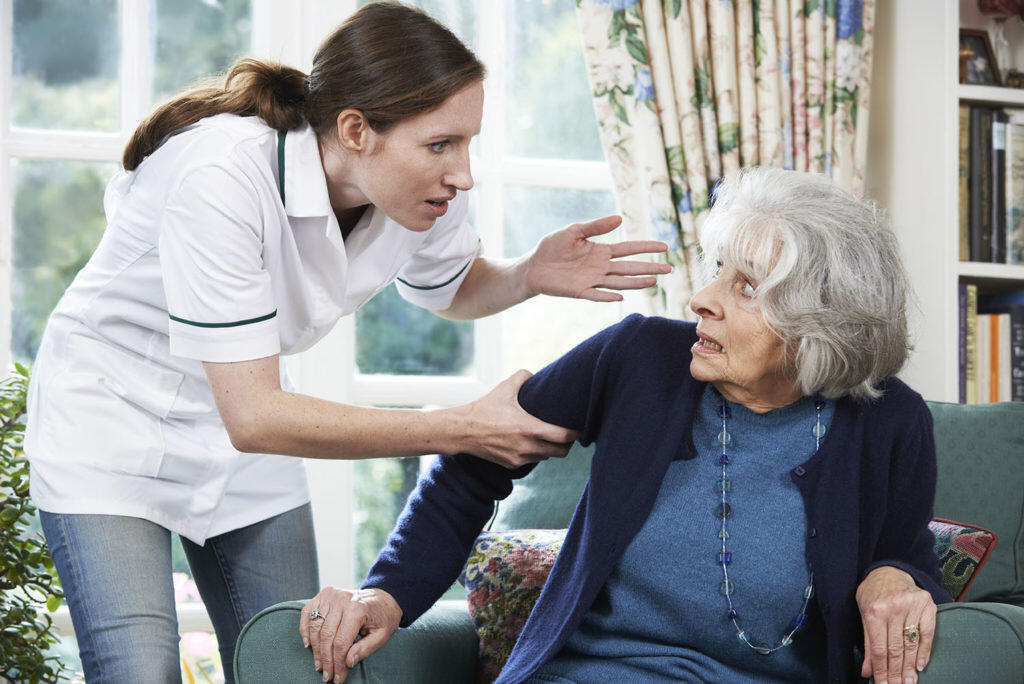 Elderly woman facing elder abuse in a nursing home