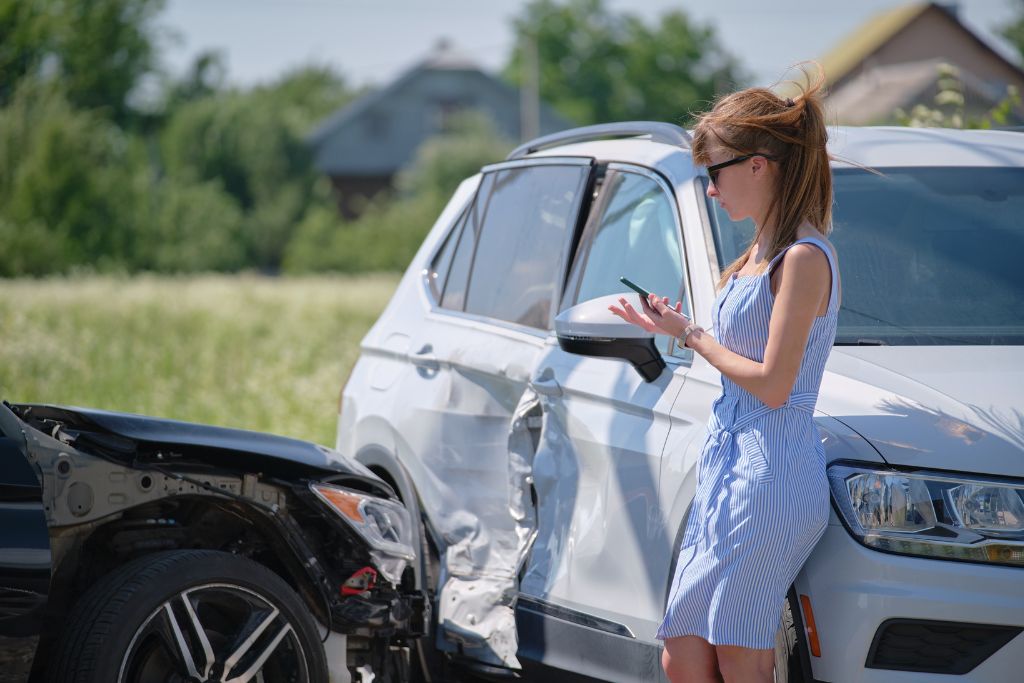 2 cars in side impact accident woman on phone