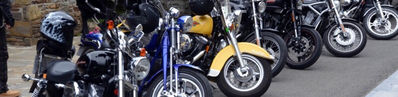 A line of motorcycles parked